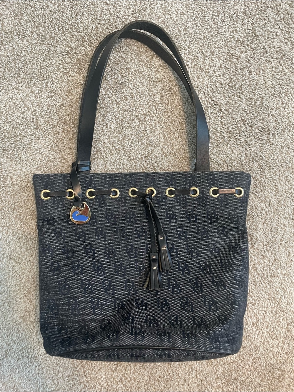 Dooney and Bourke Black Logo Bucket Shoulder Bag with Tassels and Gold Hardware
